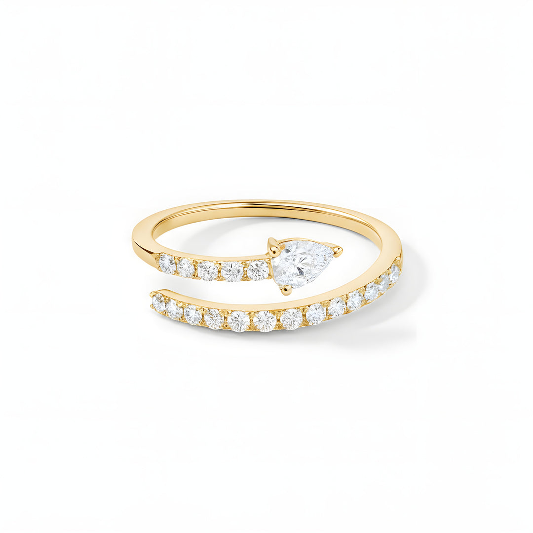 Perfect Pear ring set with a single pear and brilliant cut diamonds. Mounted in 18ct yellow gold.