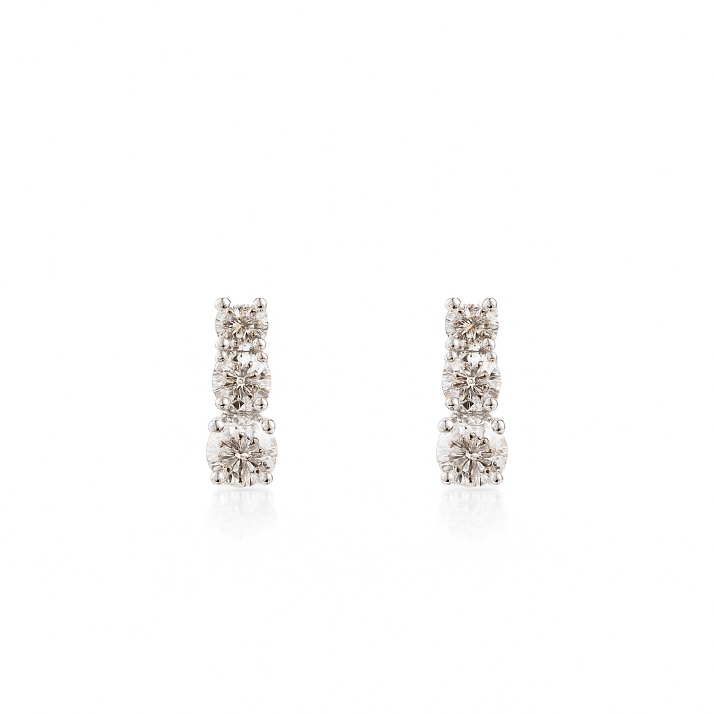 Pair of diamond earrings on a white background