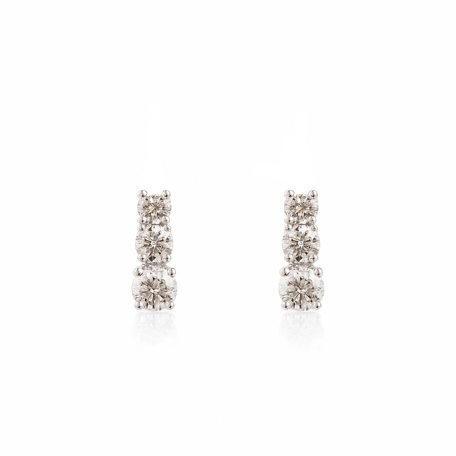 Pair of diamond earrings on a white background