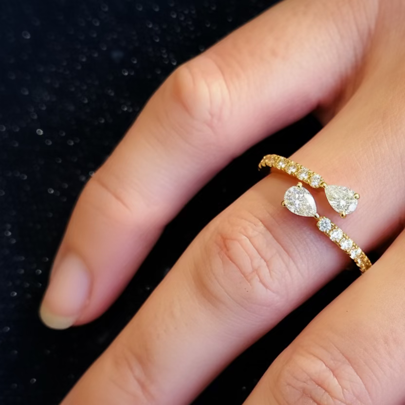 Perfect Pear ring set with two pear and brilliant cut diamonds, mounted in 18ct Yellow Gold