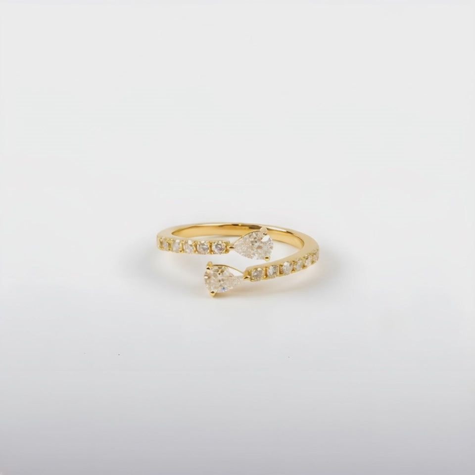 Perfect Pear ring set with two pear and brilliant cut diamonds, mounted in 18ct Yellow Gold