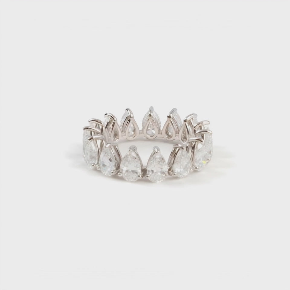 Perfect Pear full hoop eternity ring. Set with pear shaped diamonds. Mounted in platinum.